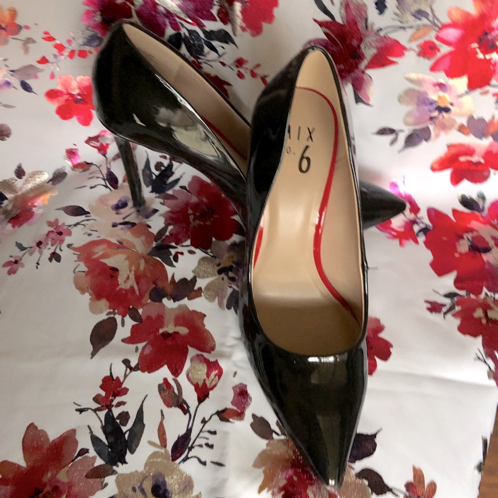 Black pointed toe pumps